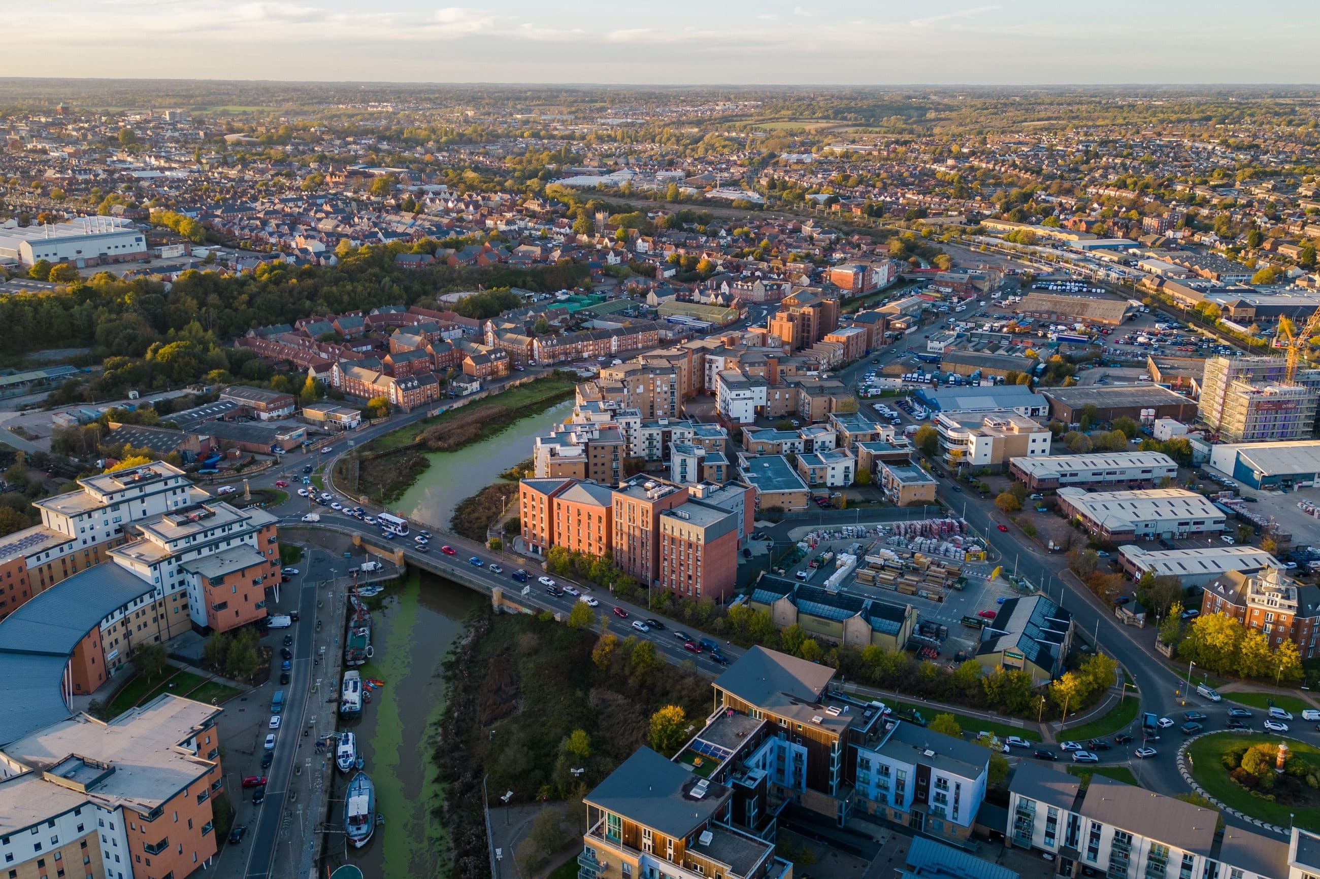 Colchester from the air at sunset, with the River Colne and the Hythe in the foreground