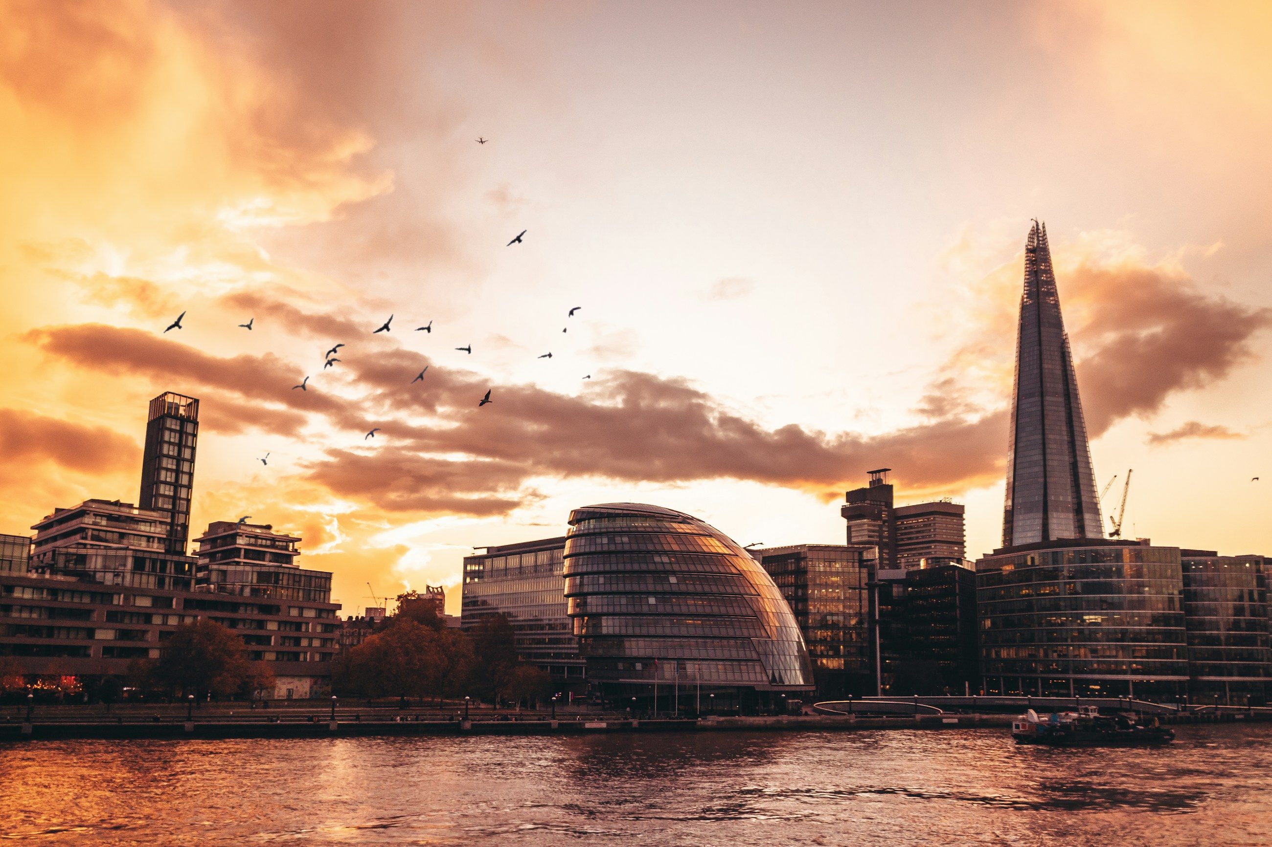 The Thames, City Hall and the City of London skyline at dusk, seen from above