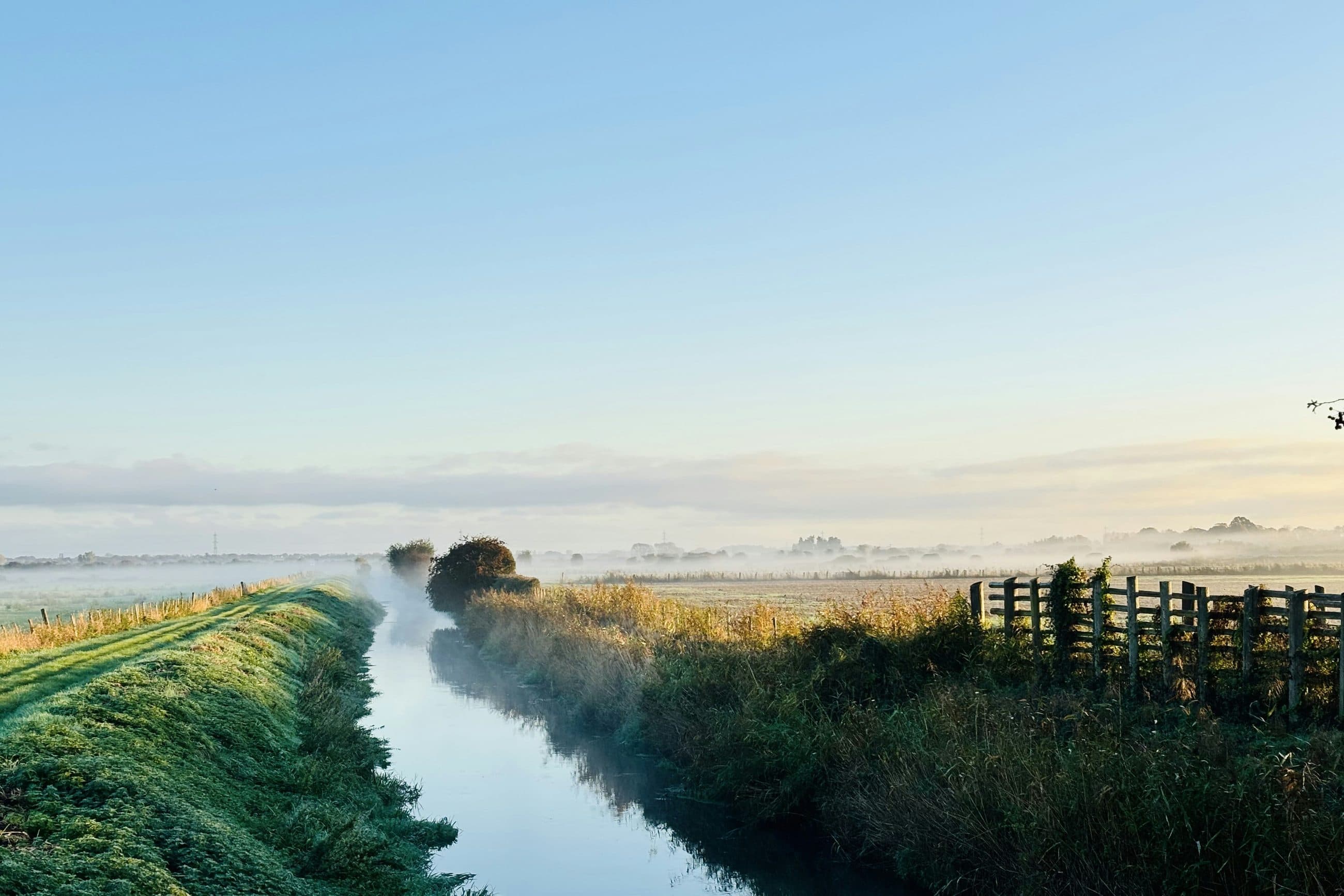 Morning mist over a small river and grazing marsh near Wickhambreaux, outside Canterbury, at sunrise