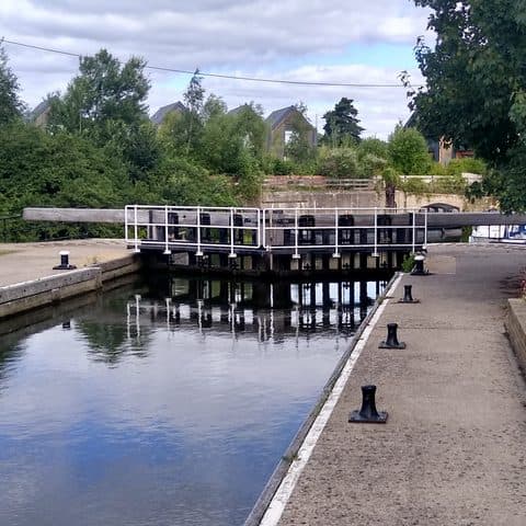 Hampstead Lock on the River Medway at Yalding, with still water and trees along the towpath